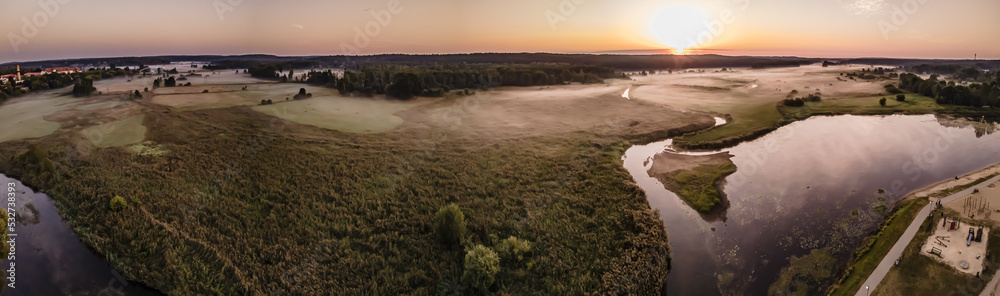 Morning fog over the Suprasl River at sunrise.