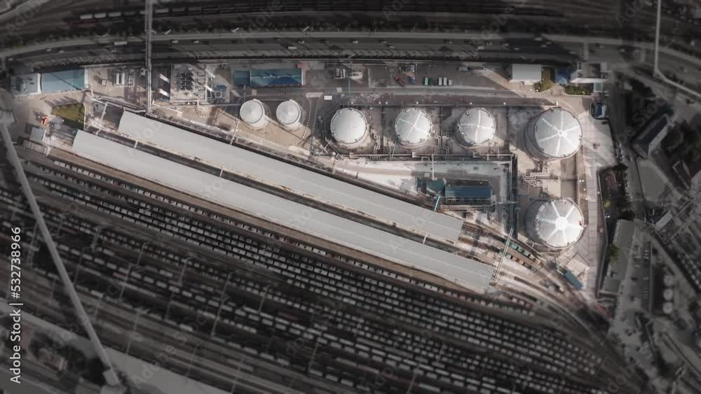 Terminal for refining oil into gasoline with a large tank farm and railroad tracks. Aerial Survey Terminal for refining oil into gasoline with a large tank farm and railroad tracks. Aerial Survey