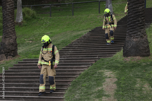 Photography Fire fighters do fitness training in full equipment at First Fleet steps in the Royal Botanic Garden, Sydney, Australia