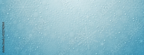 Background of complex big and small Christmas snowflakes in light blue colors. Winter illustration with falling snow