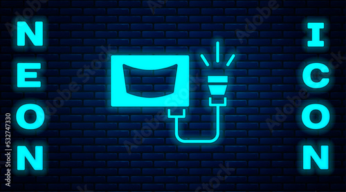 Glowing neon Ultrasound icon isolated on brick wall background. Medical equipment. Vector