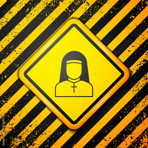 Black Nun icon isolated on yellow background. Sister of mercy. Warning sign. Vector