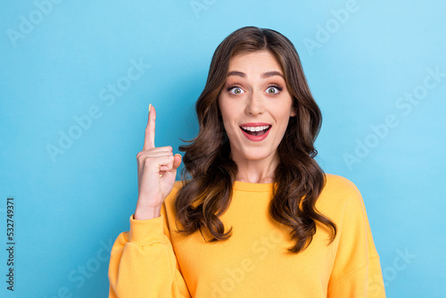 Closeup photo of young attractive nice pretty woman finger pointing up idea plan decision solution problem good joob genius isolated on blue color background photo