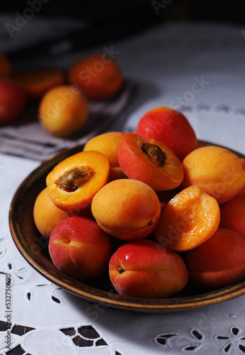 Fresh ripe apricots in bowl in rustic style	