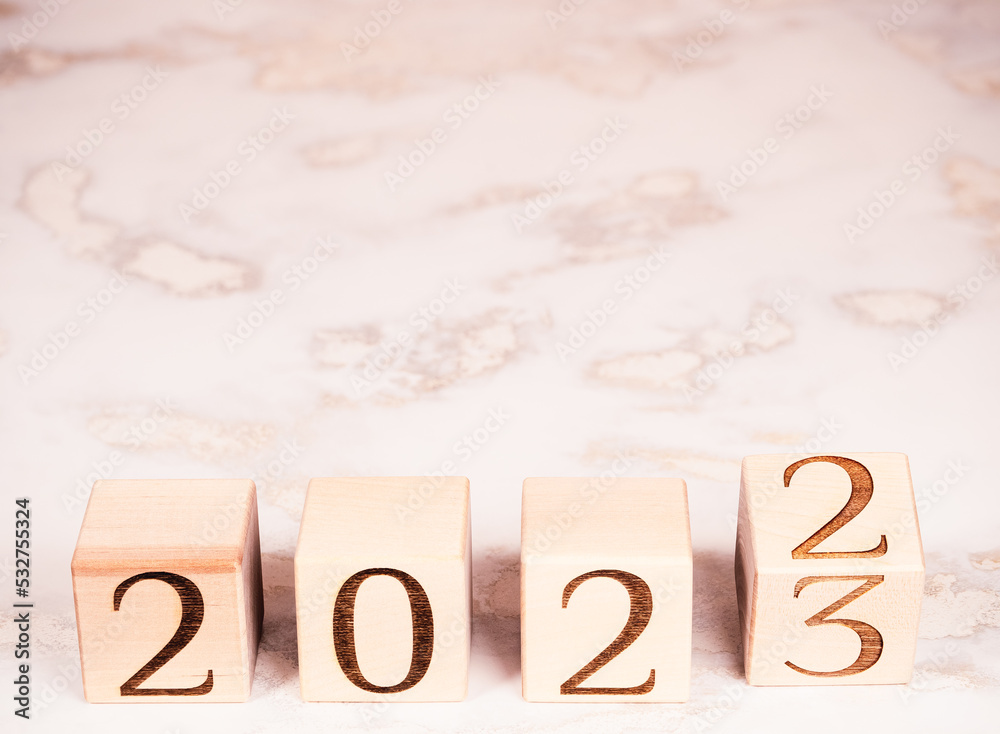 Text 2023 on wooden blocks as motivation, new goals and plans concept