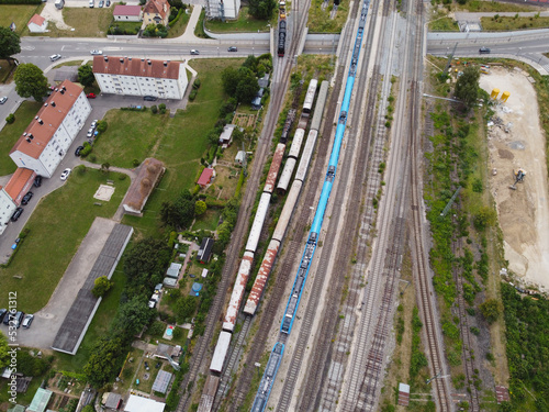 Aerial view at yard trains and railroad with wagons