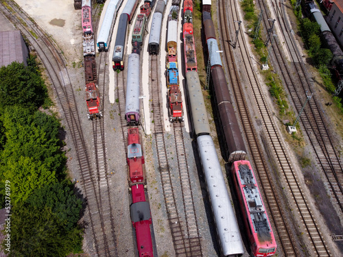 Aerial view of colorful freight trains on the railway station. 