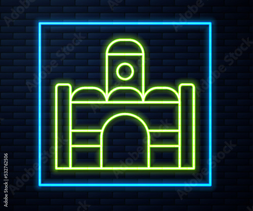 Glowing neon line Egyptian house icon isolated on brick wall background. Vector