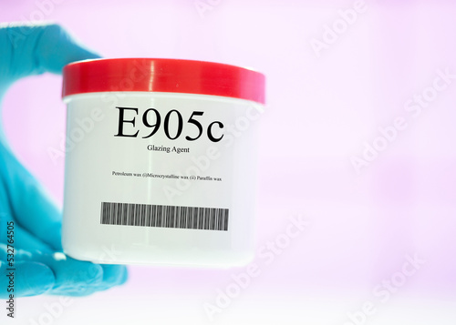 Packaging with nutritional supplements E905c glazing agent