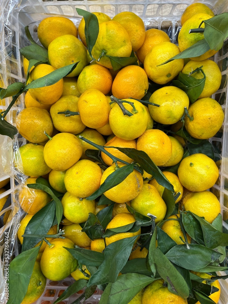 Tangerines with green leaves
