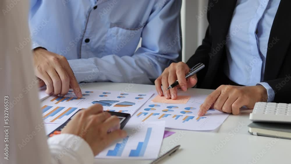 Business colleagues analyzing financial documents at office business people teamwork and brainstorming planning financial report analysis business plan investment accounting analysis concept Business colleagues analyzing financial documents at office business people teamwork and brainstorming planning financial report analysis business plan investment accounting analysis concept