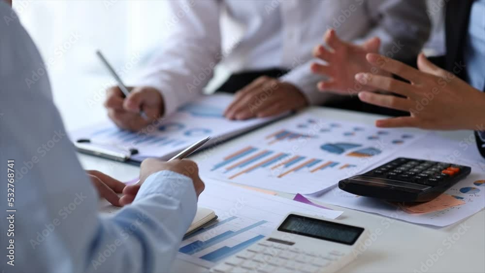 The sales department is having a monthly summary meeting to bring it to the department manager, they are verifying the correctness of the documents that are prepared before bringing in to the manager The sales department is having a monthly summary meeting to bring it to the department manager, they are verifying the correctness of the documents that are prepared before bringing in to the manager