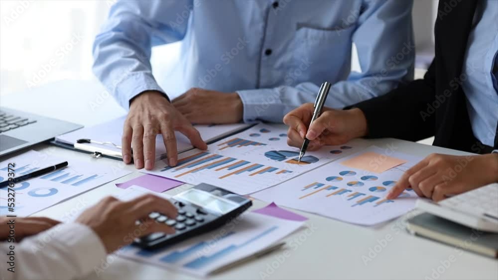 The sales department is having a monthly summary meeting to bring it to the department manager, they are verifying the correctness of the documents that are prepared before bringing in to the manager The sales department is having a monthly summary meeting to bring it to the department manager, they are verifying the correctness of the documents that are prepared before bringing in to the manager