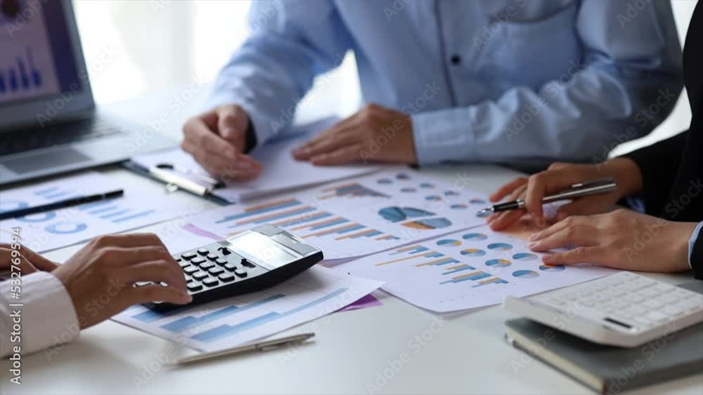 The sales department is having a monthly summary meeting to bring it to the department manager, they are verifying the correctness of the documents that are prepared before bringing in to the manager The sales department is having a monthly summary meeting to bring it to the department manager, they are verifying the correctness of the documents that are prepared before bringing in to the manager