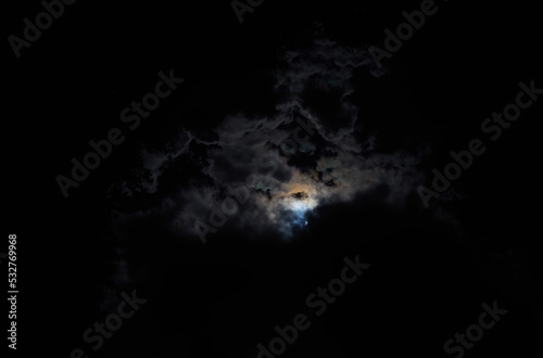 Dark moon radiation in cloudscape © spacedrone808