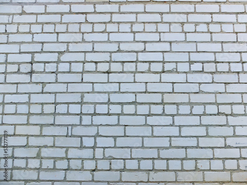 White brick wall with gray cement