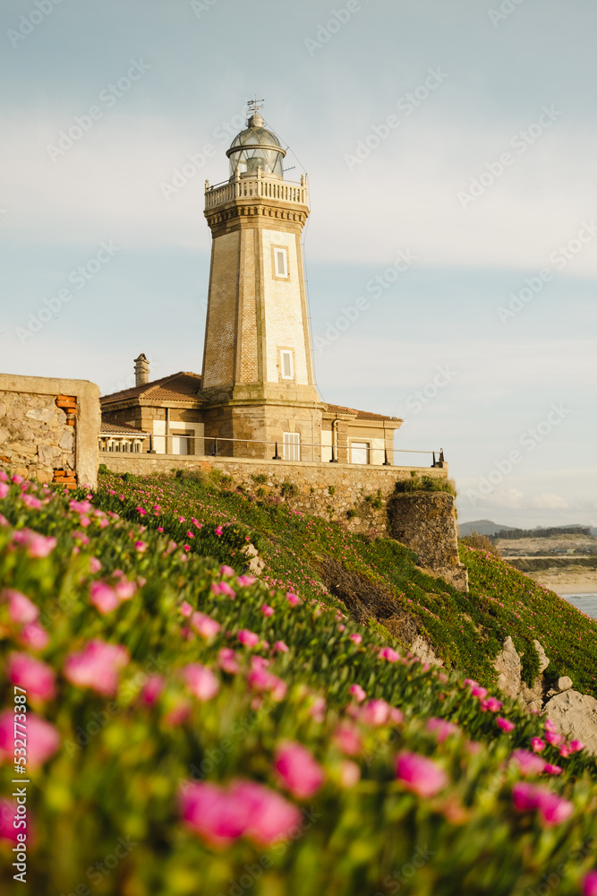 Old lighthouse on hill near sea Old lighthouse on hill near sea