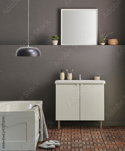 Modern bath room cabinet, sink, mirror and tub style grey wall background, vase of plant, laundry, towel and wooden stairs decorations.