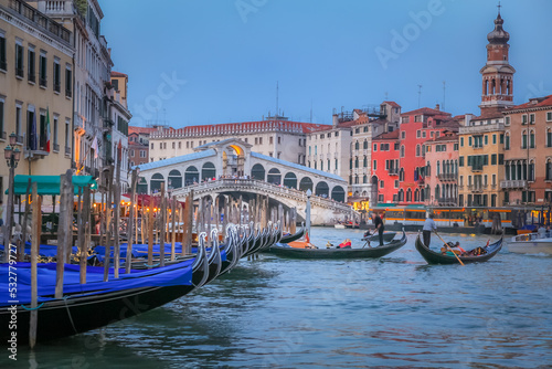 Rialto and ornate Gondolas in Grand Canal pier at sunset, Venice, Italy © Aide