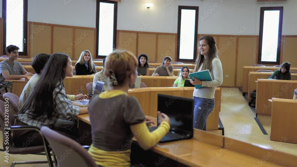 Young students listening a lesson inside university - School education concept
