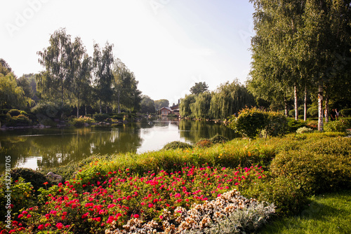 Beautiful flower beds around artificial lake