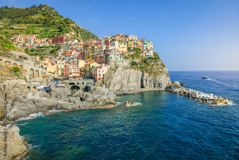 Manarola bay above cliffs, Cinque Terre, Liguria, Italy with boats