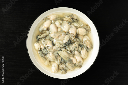 Fresh oyster meat in a simple background
