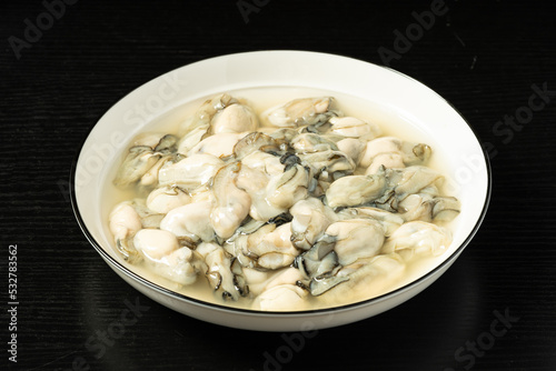 Fresh oyster meat in a simple background