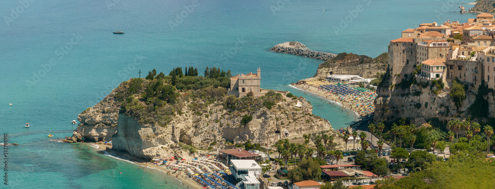 Aerial view of the cathedral, Cathedral of Maria Santissima of Romania. Roofs and houses of the city of Tropea, Calabria. Italy. Sea life, holiday
