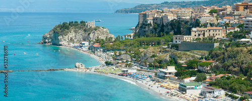 Fototapeta Naklejka Na Ścianę i Meble -  Aerial view of Tropea, house on the rock and Sanctuary of Santa Maria dell'Isola, Calabria. Italy. Tourist destinations of the most famous in Southern Italy, seaside resort located on a cliff 