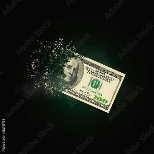 100 dollar bills scattered in the air. money inflation concept. the disappearance of banknotes, hyperinflation. financial crash, hundred dollar banknotes, high living costs. photo