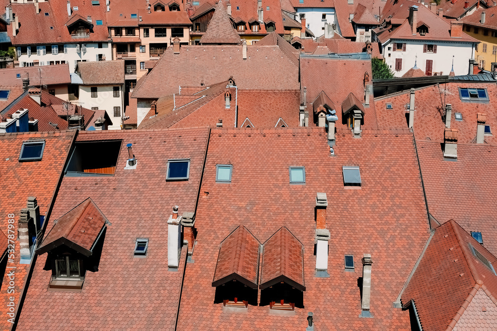 Geneva, switzerland- august 2022: red tile roofs of the old city of Geneva seen from above. Geneva, switzerland- august 2022: red tile roofs of the old city of Geneva seen from above.
