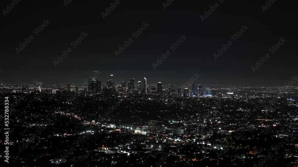 Beautiful night view of Los Angeles, California from above. Timelapse video. Busy night city aerial view.