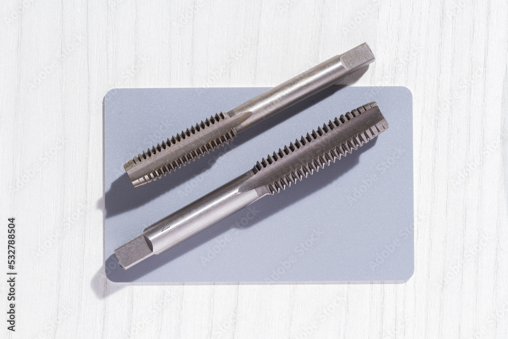 close-up image of drill bit, or tap for threads in steel close-up image of drill bit, or tap for threads in steel