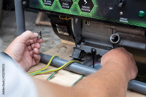 Changing the oil on a portable generator.