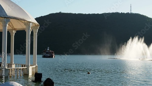 Tourist ship Champagne on lake Abrau near the fountain.