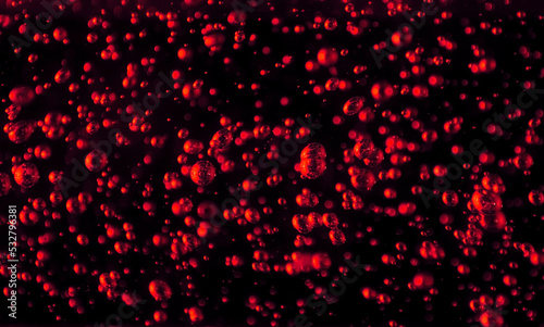 Bubbles close-up on a black background. Oxygen cocktail. Carbonated drink with lots of bright bubbles.