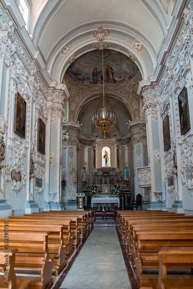 Interior of baroque style Chiesa di San Giuseppe Cathedral. Beautiful majestic basilica at townsquare in old coastal city. Details and design in famous tourist attraction.