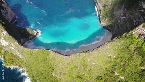 Aerial HD drone footage of incredible rock formation in the middle of Nusa Penida's coastline with amazing deep blue sea beaches and cliffs, Bali, Indonesia.
Traveling + tilt movements, zenithal angle photo