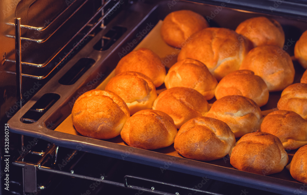 Buns in the oven on a baking sheet