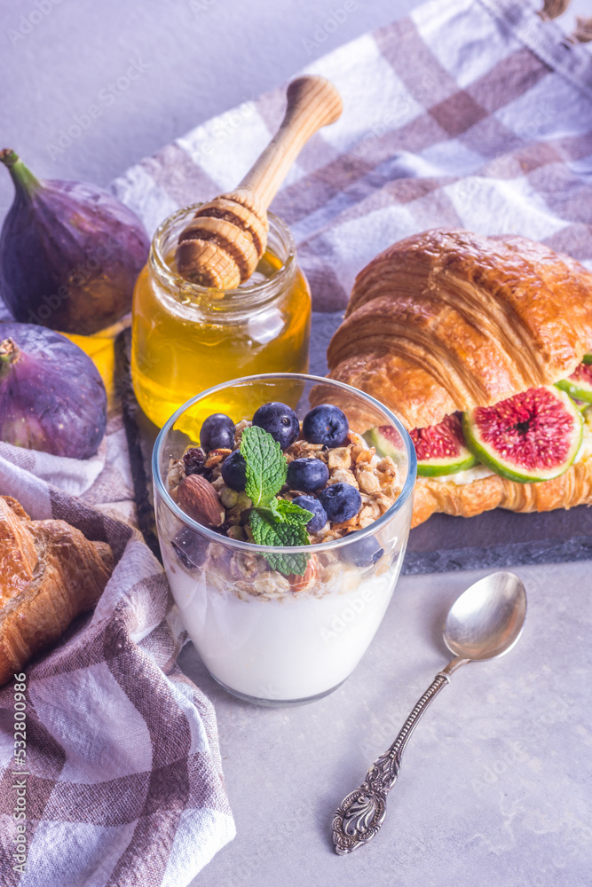 Homemade sugar free yogurt with granola, honey and berries