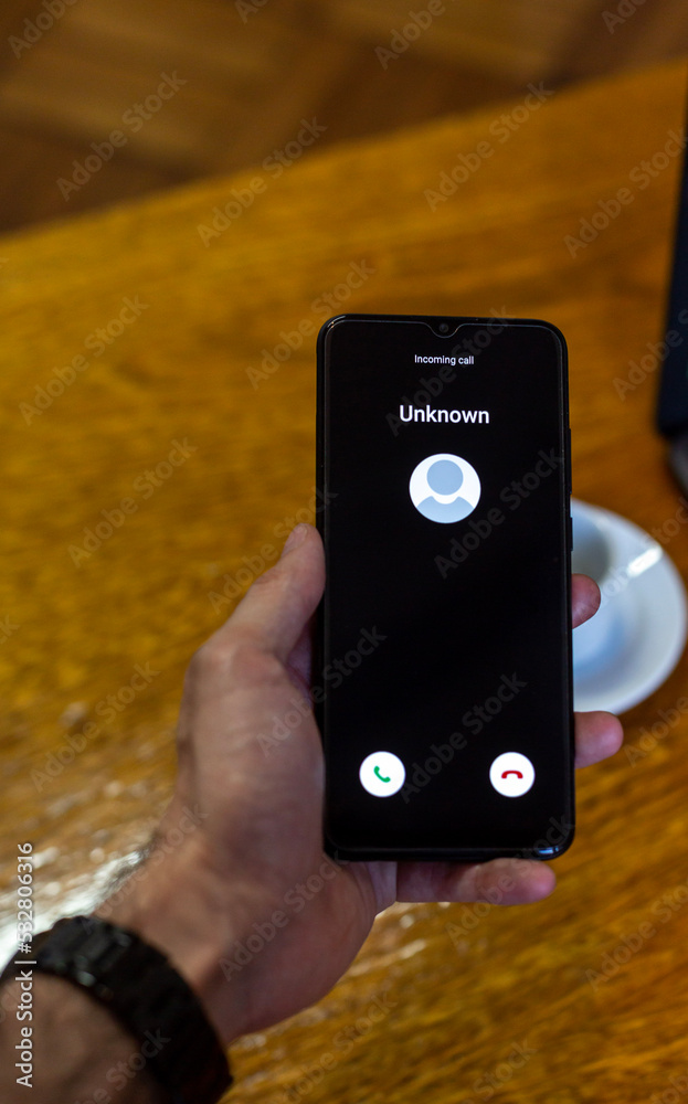 custom made wallpaper toronto digitalPhone call from unknown number. Scam, fraud or phishing with smartphone concept. Prank caller, scammer or stranger. Man answering to incoming call. Hoax person with fake identity.