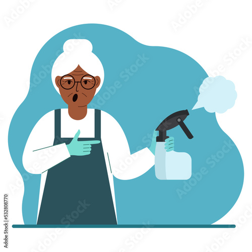 A woman in gloves holds a spray bottle with disinfectant liquid, antiseptic or detergent. Home disinfection and hygiene.