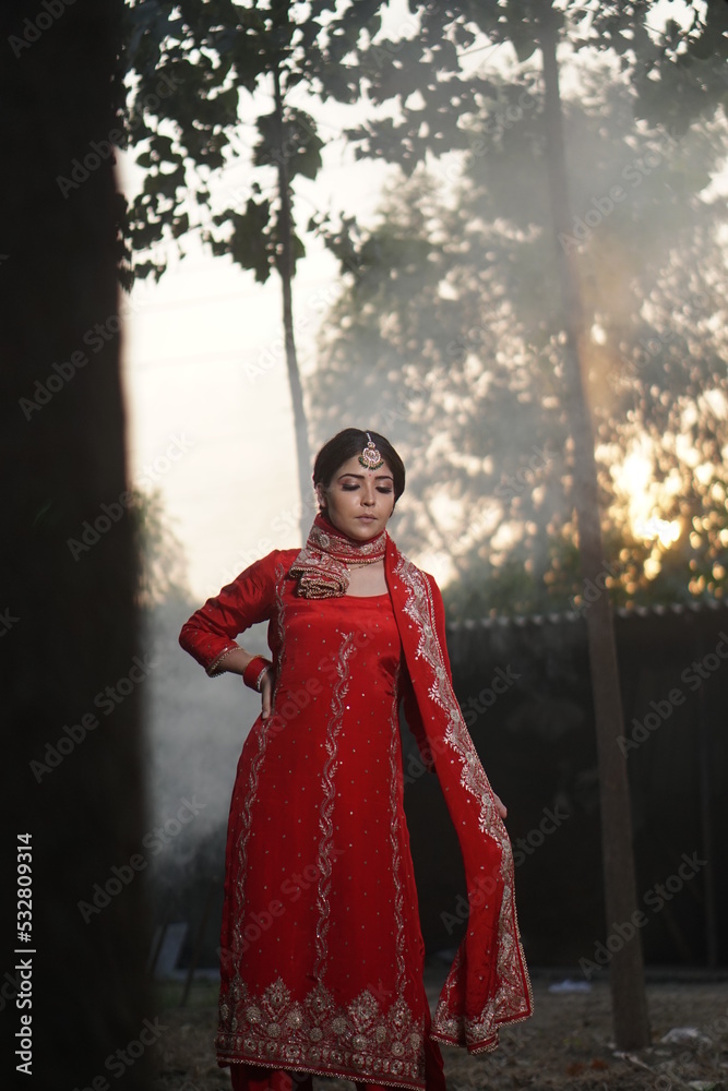 girl wearing red suit and fire in backdrop