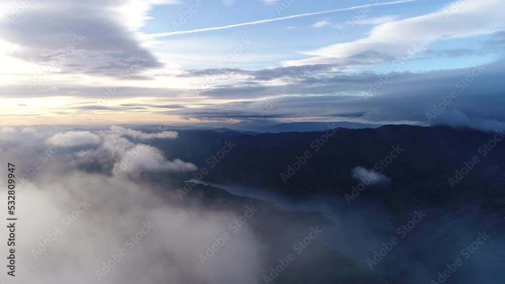 Clouds Above The Mountain with River in the Background. Nature Landscape. Environment Concept. Copy Space. 4k Clouds Above The Mountain with River in the Background. Nature Landscape. Environment Concept. Copy Space. 4k