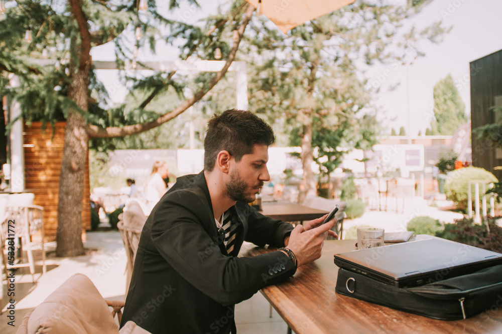 Business man looking at the phone Business man looking at the phone