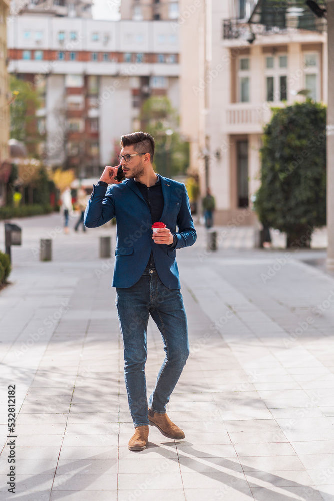Handsome businessman walking on the street Handsome businessman walking on the street