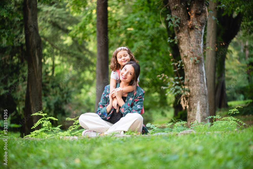 mother and daughter hugging each other happily and smiling mother and daughter hugging each other happily and smiling