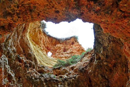 Rough Vertical Hole in Sandstone Cliff