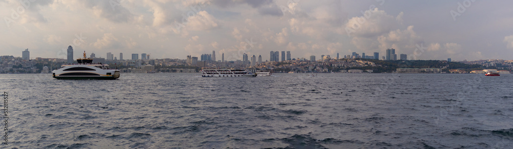 Naklejka premium silhouette Istanbul city buildings from water Bosphorus or Golden Horn, public places.